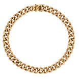 A gold curb-link chain bracelet, the clasp stamped '18K' and '750', length approximately 21c...