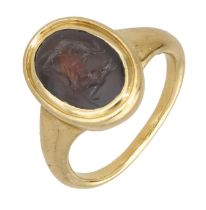 A 19th century hardstone intaglio ring, the oval agate plaque carved to depict an erotic sce...