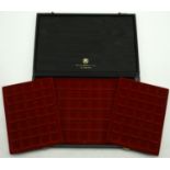 An Abafil Minidiplomat case, with three loose trays to house a total of 124 coins, 36 x 24 x...