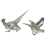 A matched pair of silver ornaments, a cock and hen pheasants, realistically modelled, the co...