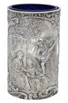 A Victoria silver cylinder vase, repoussÃ© decorated with a Watteau-esque scene of a lutanist...