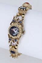 Eloga Watch Co. A lady's gold and gem-set bracelet watch, circa 1960. Movement: manual wind...