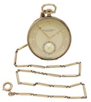 International Watch Co. A gold open-faced keyless watch with a gold chain, circa 1930. Move...