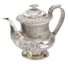 A George IV silver teapot, the baluster body with fluting above a band of flowerheads and fo...