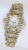 Tissot. A lady's gold bracelet watch, Stylist, circa 1970. Movement: manual winding. Dial:...