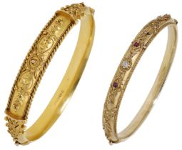 A 15ct gold bangle, 1907, with applied ropetwist and bead decoration in a scroll and foliate...