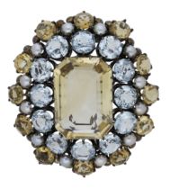 An Arts and Crafts gem-set brooch attributed to Dorrie Nossiter, circa 1930, the step-cut ci...
