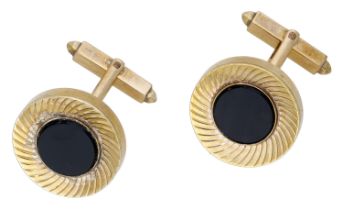 A pair of onyx cufflinks, each inlaid with a circular polished onyx plaque within a reeded w...