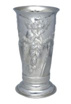 A Victoria silver beaker vase, repoussÃ© decorated with flowerheads, foliage and C scrolls, o...