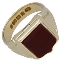 A gold signet and locket ring by Charles Green, 1883, the shield-shaped agate plaque plain p...