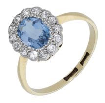 An early 20th century aquamarine and diamond ring, the oval-cut aquamarine in a surround of...