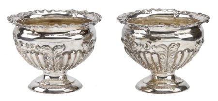 A pair of Victoria silver small footed bowls, with half-lobed and foliate repoussÃ© decoratio...