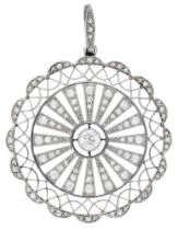 A diamond pendant, circa 1915, the pierced circular plaque with an old brilliant-cut diamond...