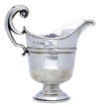 An Edward VII silver cream jug, of early Georgian design, with double 'C'-scroll handle and...