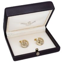 A pair of 18ct gold 'Calatrava' cufflinks by Patek Philippe, the 'Calatrava Cross' within re...