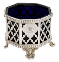 A Victoria silver octagonal mustard, with open latticework sides, on four foliate feet, cres...