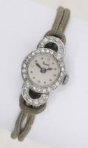 Solvil. A lady's platinum and diamond-set cocktail watch, circa 1930. Movement: manual wind...