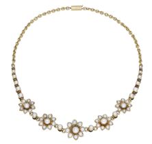 A pearl necklace, circa 1900, the front designed as a series of pearl-set flowerheads, space...