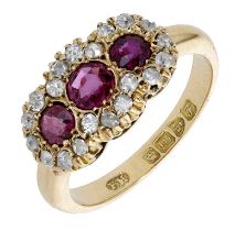 A ruby and diamond cluster ring, 1906, the three graduated circular-cut rubies each in a sur...