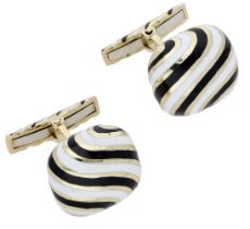 A pair of enamel cufflinks by David Webb, the cushion-shaped plaques with black and white en...