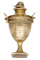 A 19th century fob seal, designed as a racing trophy cup, engraved with scroll and foliate d...