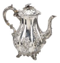 A Victoria silver coffee pot, the pear-shaped body with lobed panels repoussÃ© decorated in h...