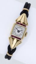 Swiss. A lady's gold and synthetic ruby-set wristwatch, circa 1952. Movement: manual windin...