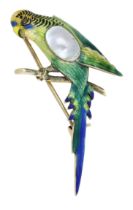 A novelty budgerigar brooch, realistically modelled, the bird with polychrome enamel decorat...