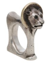 A silver lion ring by Mosheh Oved, circa 1945, of angular form with hammered finish, the man...