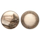 Yachting, c. 1900, a plated bronze award medal, unsigned, two yachtsmen at the helm of a lar...
