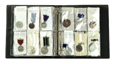 A collection of school attendance medals, 1873-1914, in silver (2), bronze (18), and white m...