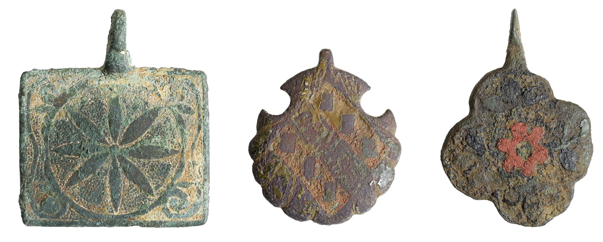 13th-14th century, heraldic/decorative pendants (3), including quatrefoil-shape with pierced...