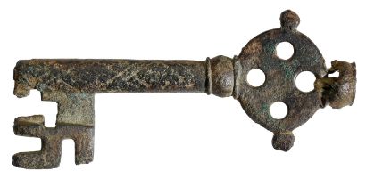 Late 13th century, bronze door key, 90mm x 38mm, solid oval bow with four circular piercings...