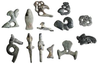 Assorted bronze zoomorphic artefacts (13), Celtic-Byzantine, including bird heads (3); horse...