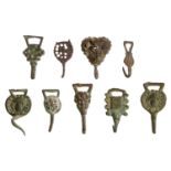 Tudor, brass dress fasteners (9), including facing head; scallop shell; head of John the Bap...