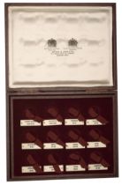 A maroon coin case by Spink and Son, for the '12 Caesars' series, removable inner tray with...