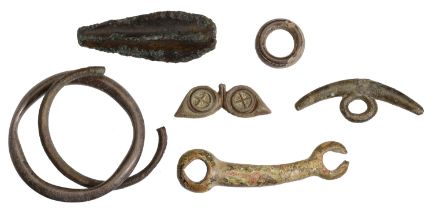 Celtic, bronze artefacts (6), including part of a horse bit; woad grinder, crescent shape wi...