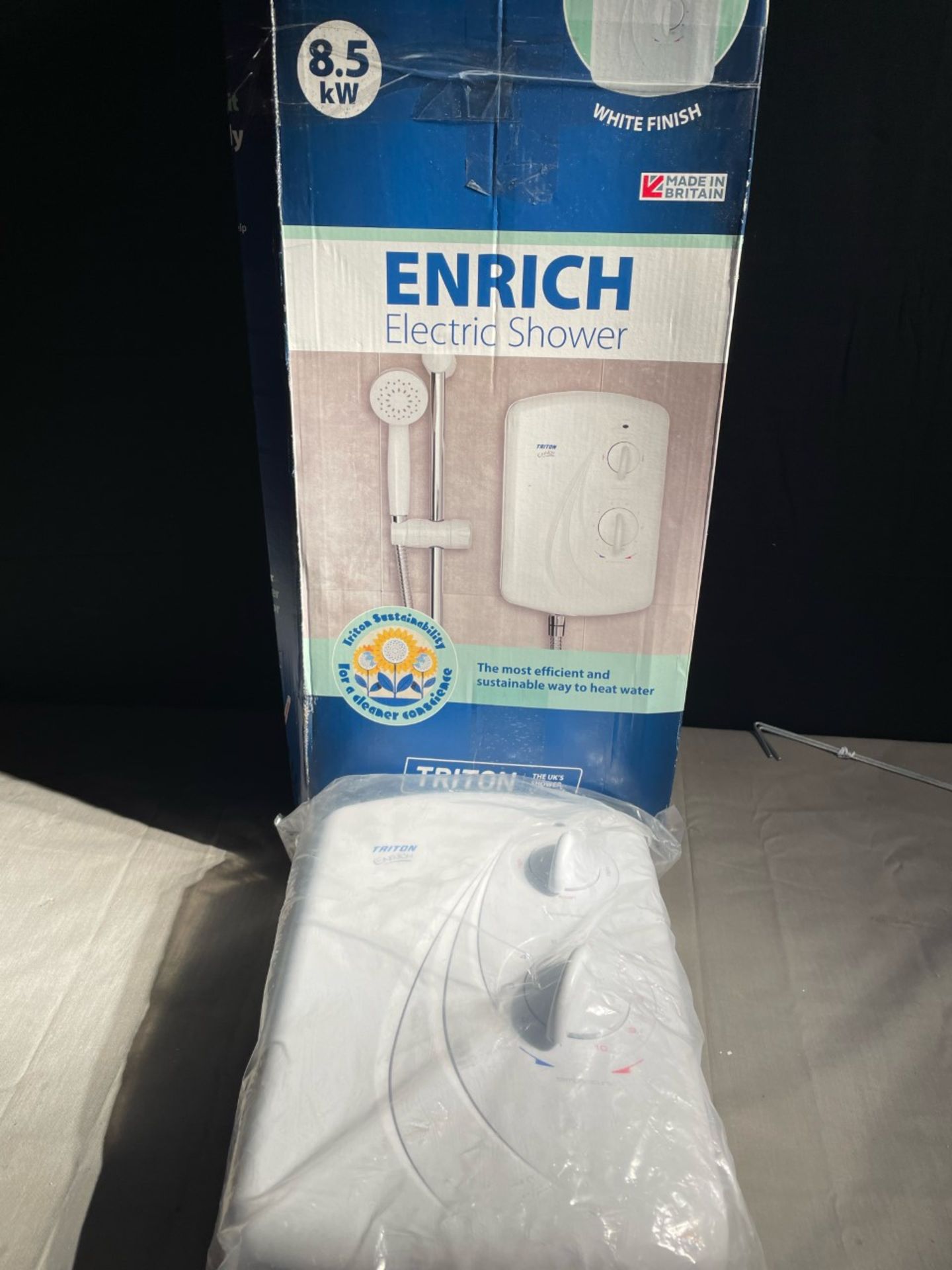 Enrich 8.kw electric shower. Unit is new in box. Working order is unknown