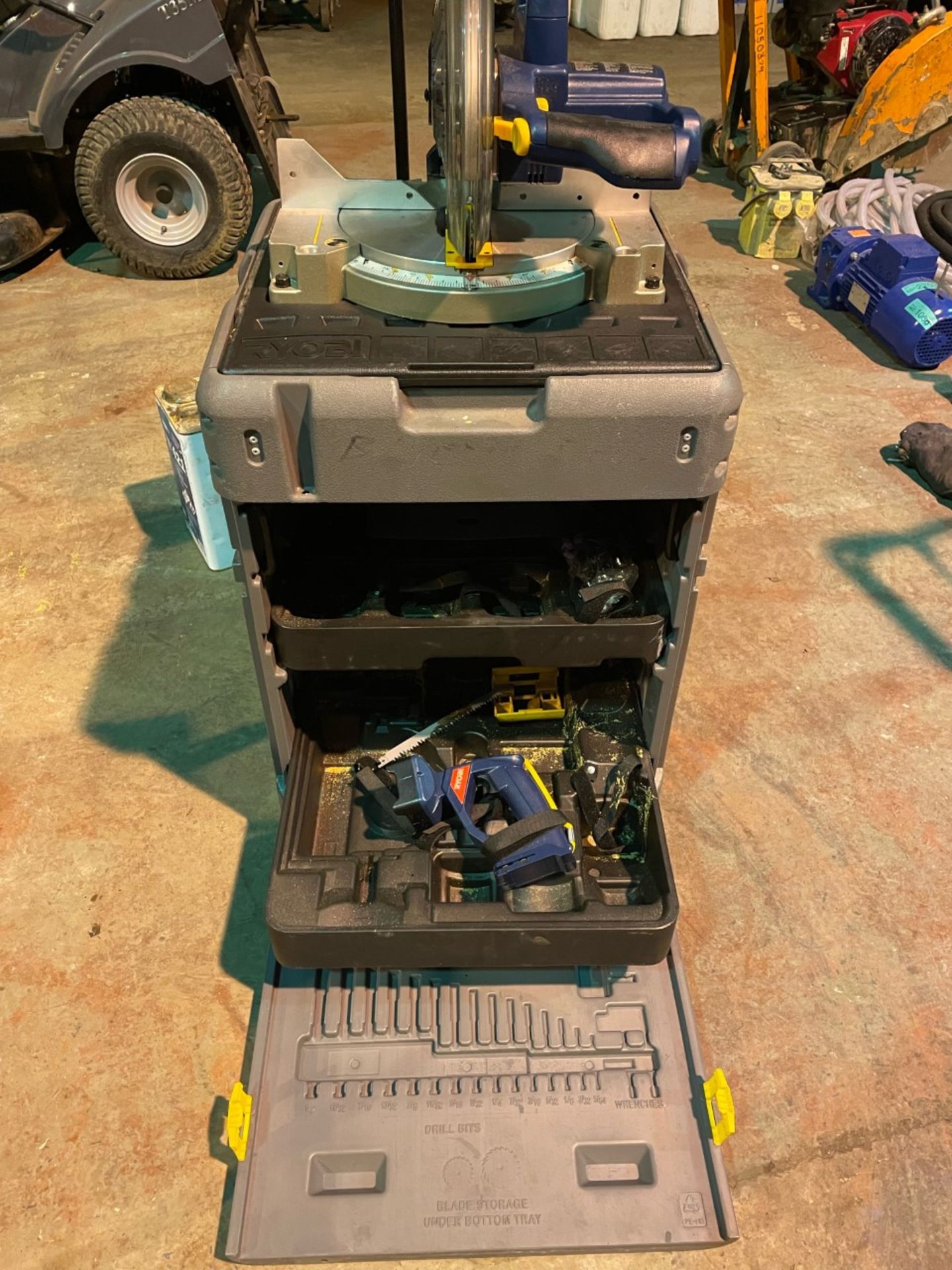 Ryobi 18v mitre saw on portable workstation. No batteries included. Saw is nearly new.