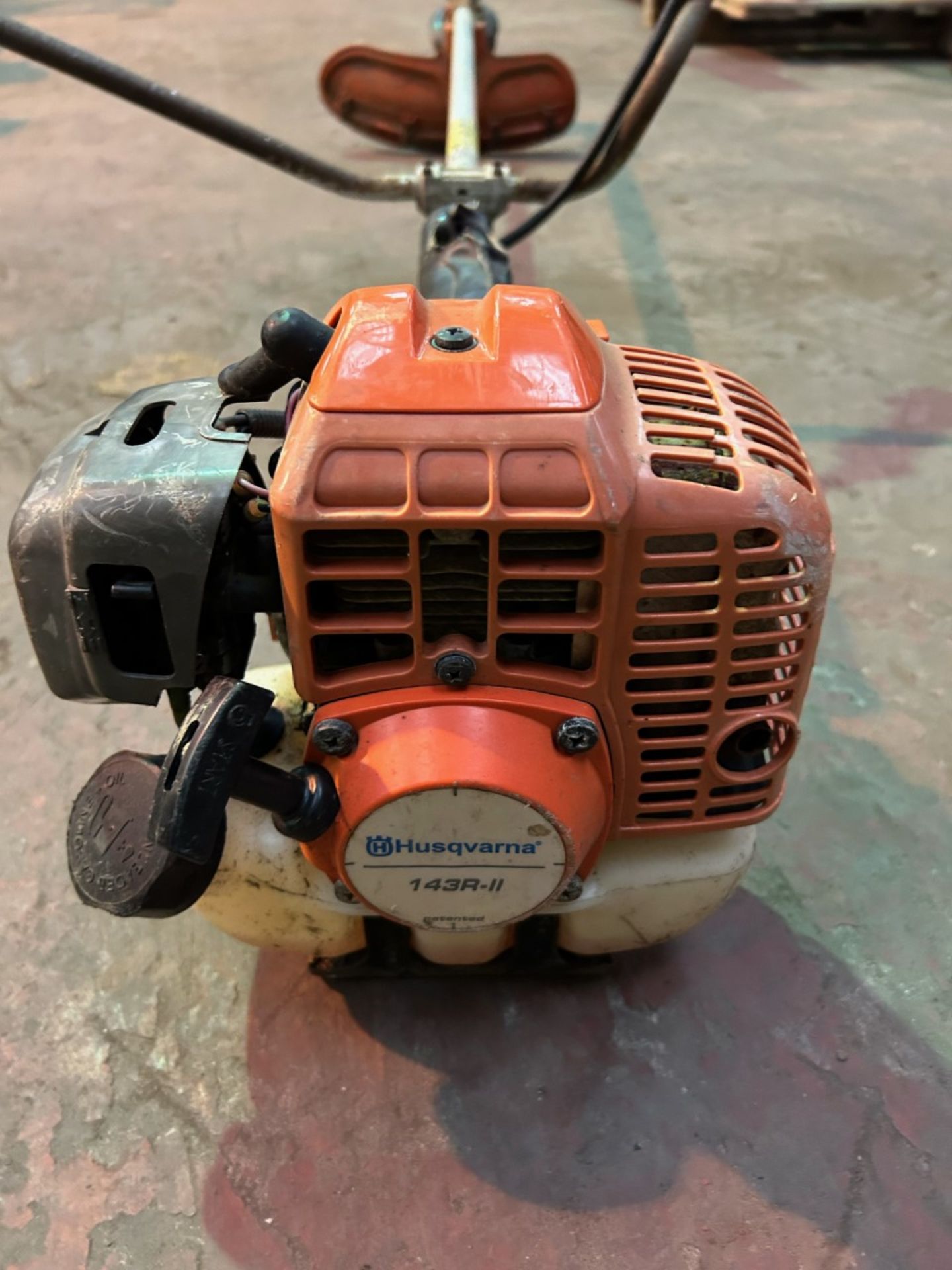 Husqvarna 143R garden strimmer. Average condition slight rust on handle bars.