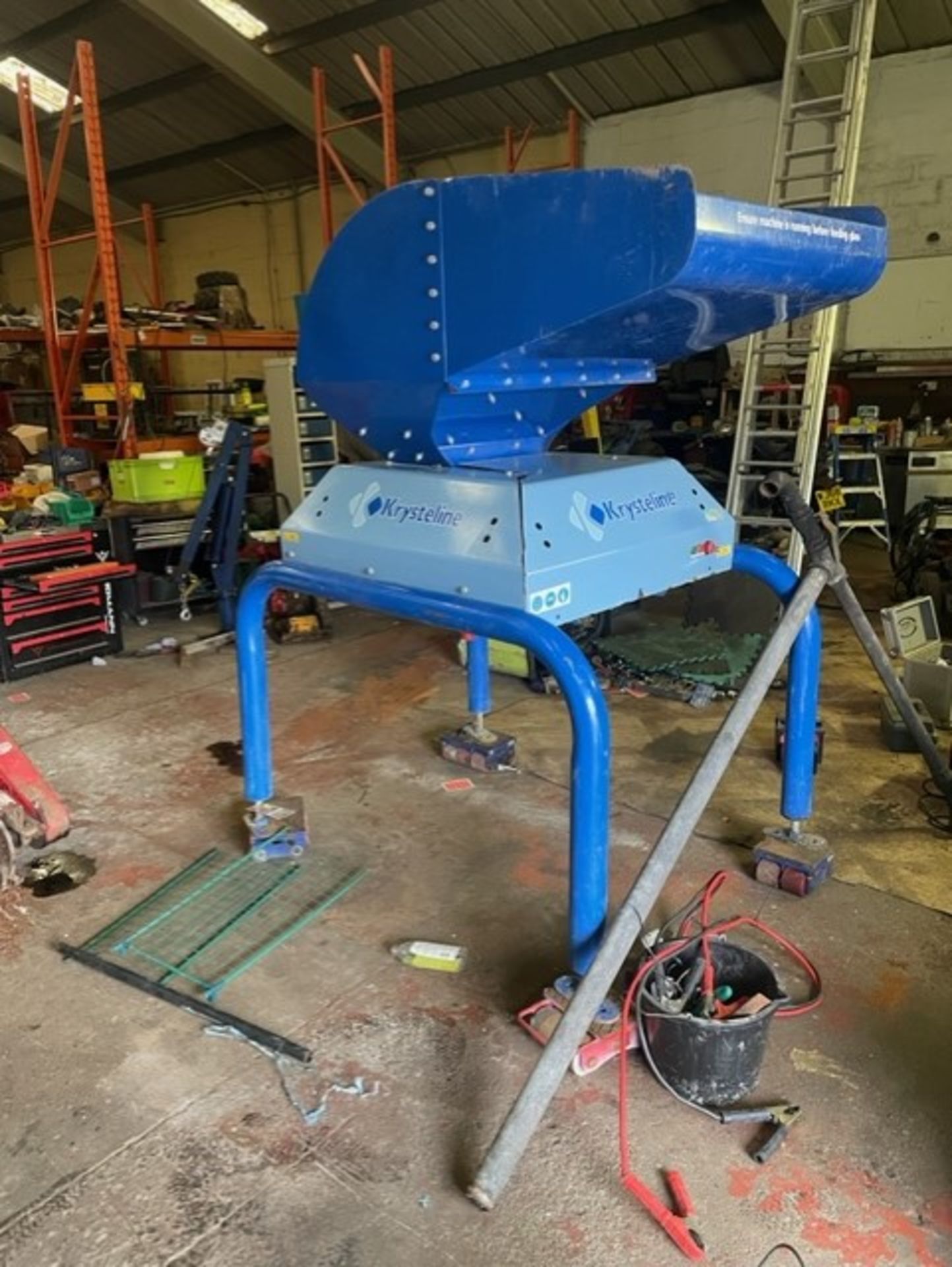 Krysteline glass crushing machine you throw bottles in shoot at top and they go through the