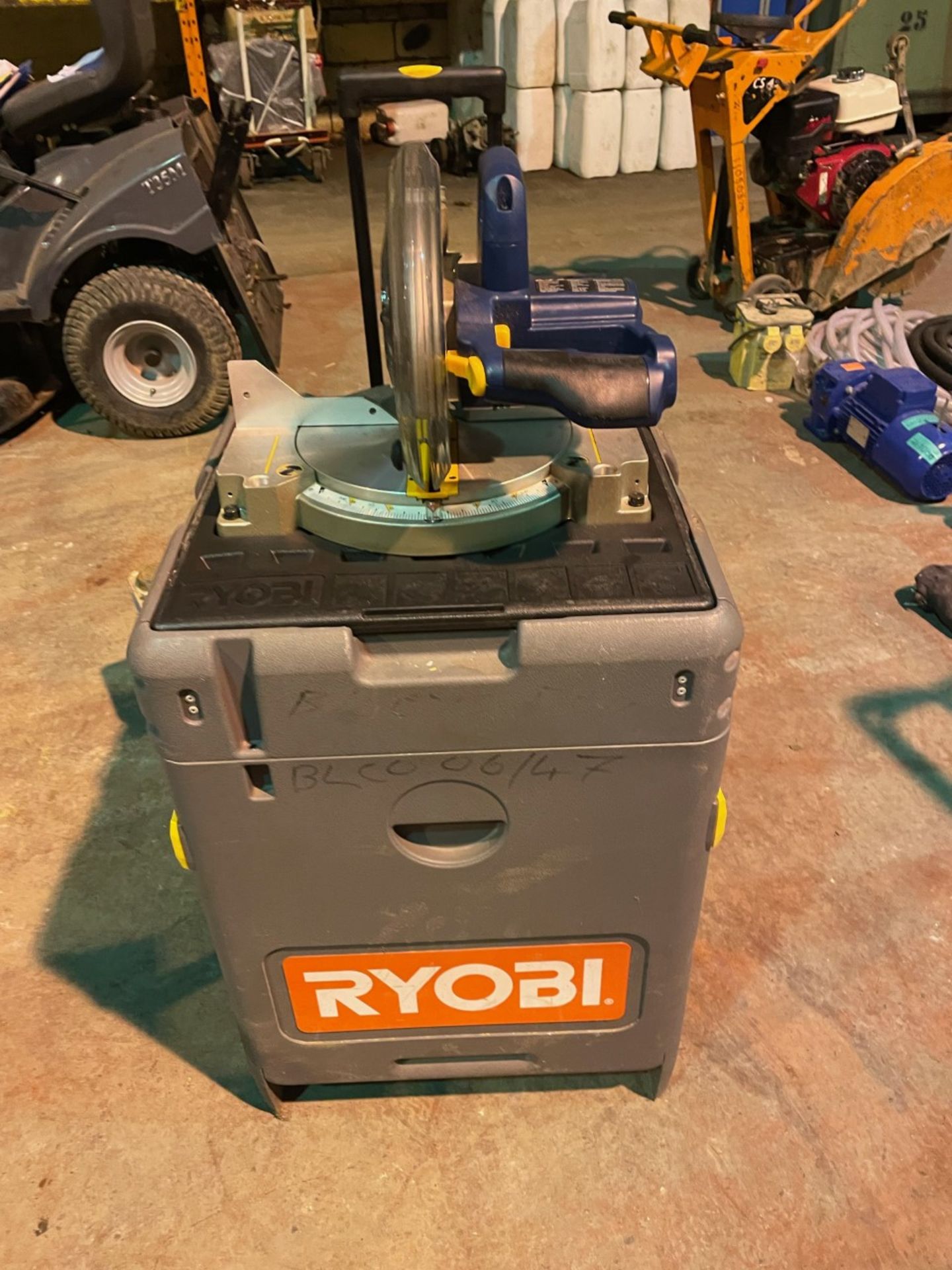 Ryobi 18v mitre saw on portable workstation. No batteries included. Saw is nearly new.