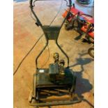 Old push along roller mower