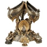 AN IMPRESSIVE BRASS CENTREPIECE, a trio of teardrop vessels with repousse decoration and pierced