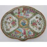 A CHINESE FAMILLE ROSE DISH QING DYNASTY, 19TH CENTURY painted with courtiers, butterflies and