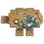 A CHINESE LACQUER TABLE AND SIX STOOLS, decorated with two peacocks perched amongst flowering