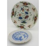 DUTCH DELFT POLYCHROME CHARGER  18TH CENTURY decorated with blossoming flowers in a rocky outcrop,