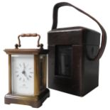 A SWISS MADE BRASS CASED MINIATURE CARRIAGE CLOCK, eleven jewels, the face inscribed 'Matthew
