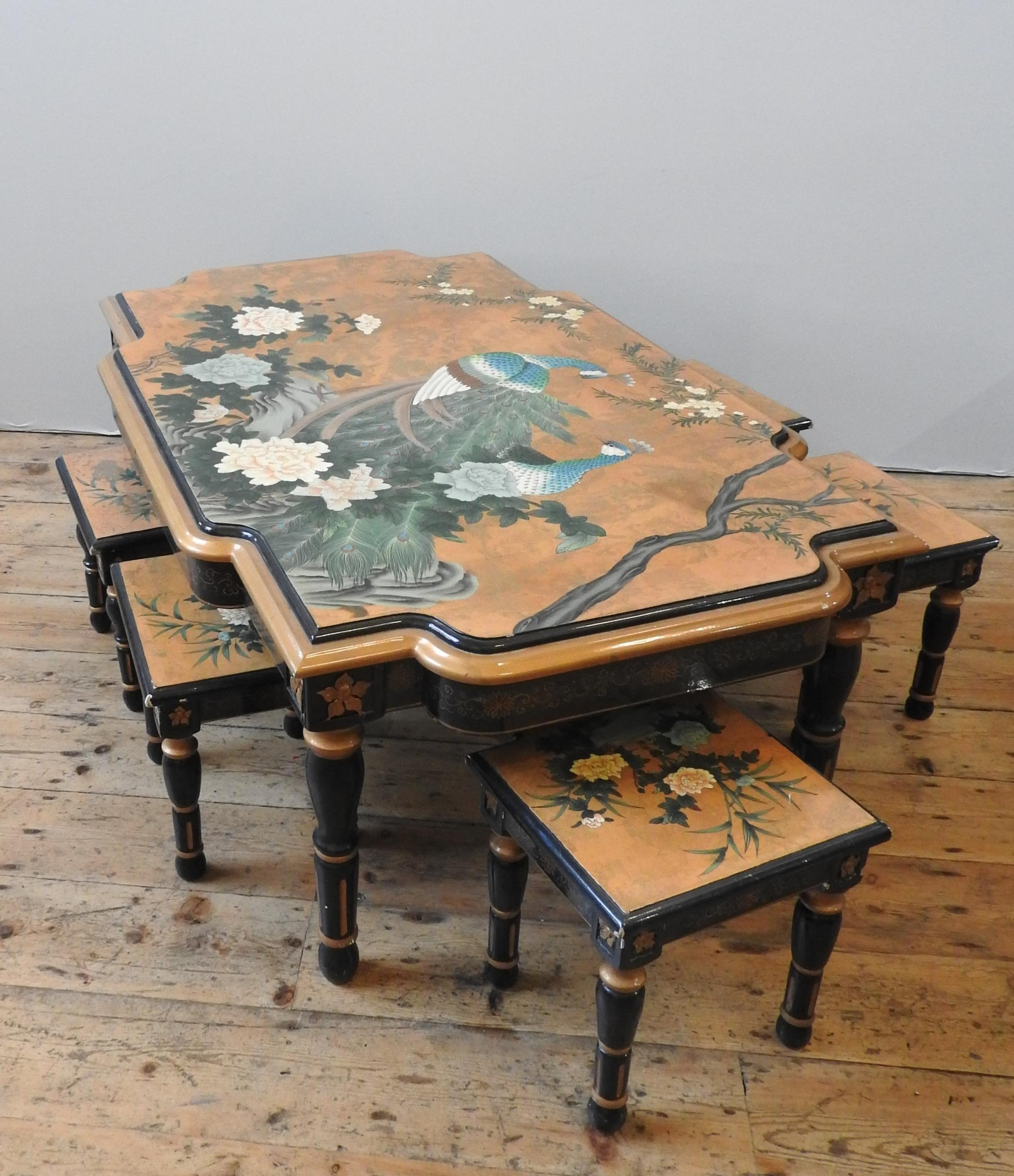 A CHINESE LACQUER TABLE AND SIX STOOLS, decorated with two peacocks perched amongst flowering - Image 3 of 3