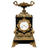 A FRENCH BRONZE AND BLACK SLATE MANTEL CLOCK, circa 1860, striking movement by Japy Freres with silk